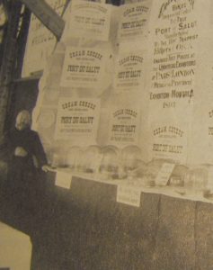 Brother Alphonse Juin with advertisements for Oka cheese